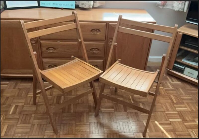 A pair of mid-century wooden folding chairs